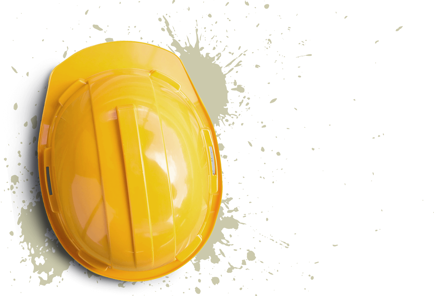Overhead view of a yellow hard hat with splattered tan paint underneath